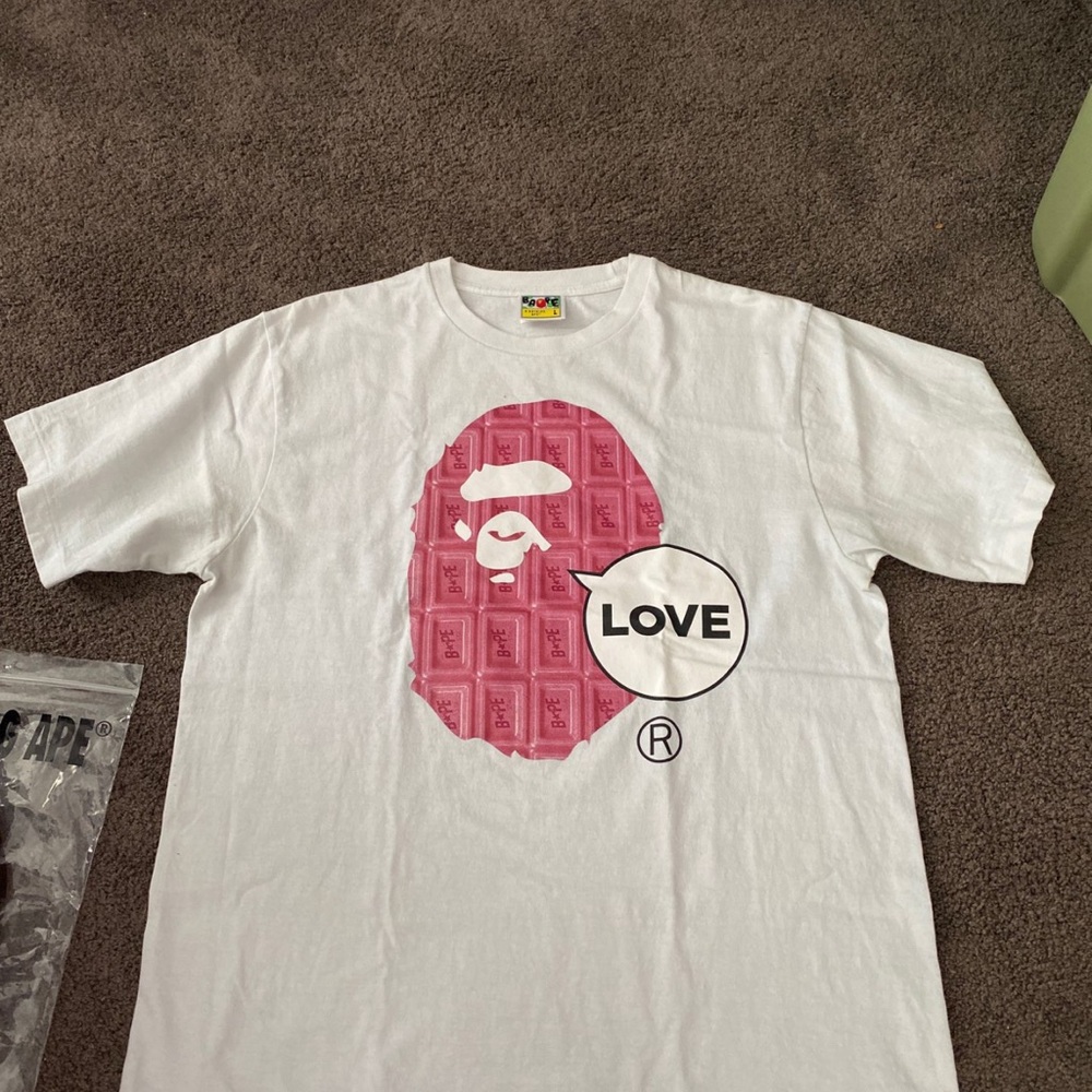 A Bathing Ape White T-Shirt with Pink Graphic